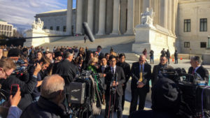 Simon Tam, a member of the band The Slants, speaks to reporters outside the Supreme Court on Wednesday.